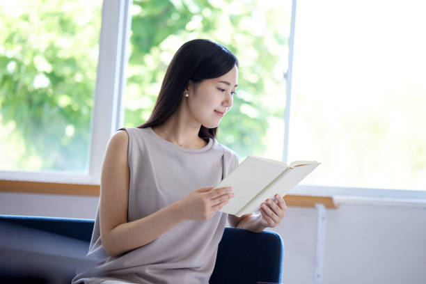 A young Japanese woman relaxing in the living room